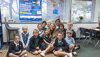 kids and teacher in a classroom