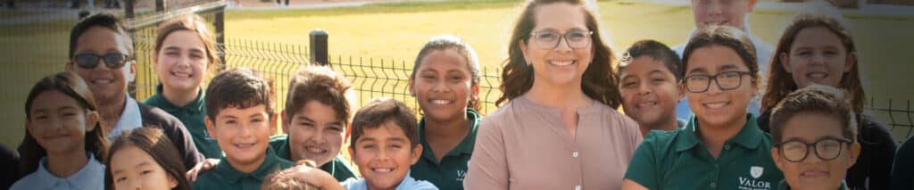students and teacher outdoors